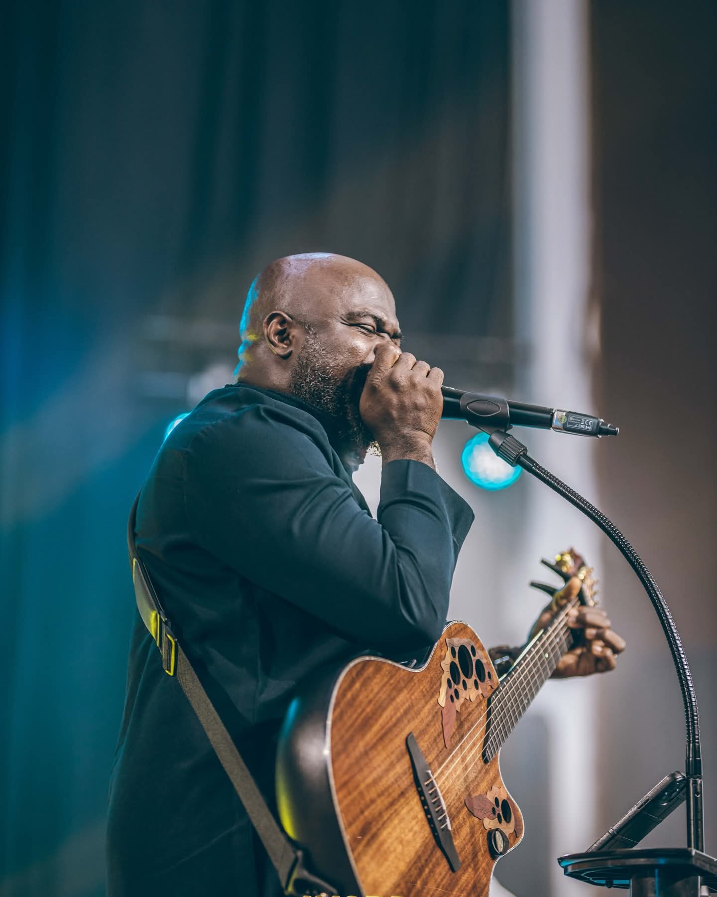 Moses singing with guitar