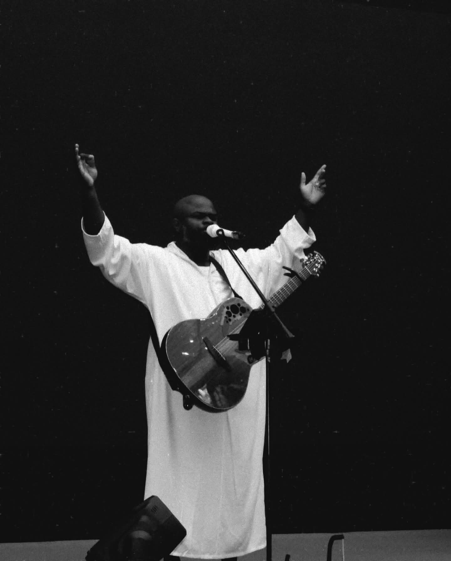 Moses performing on stage