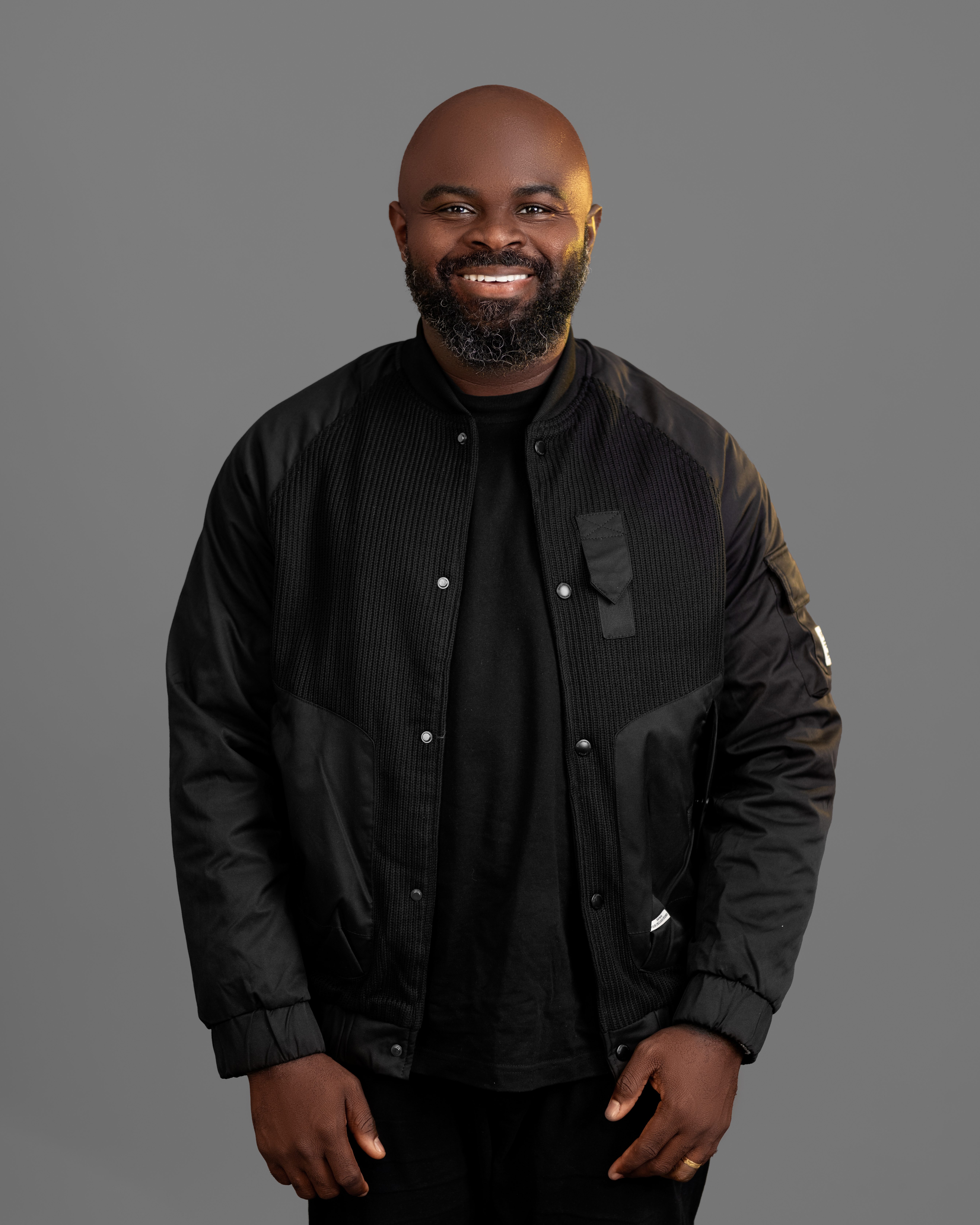 Moses performing on stage with guitar